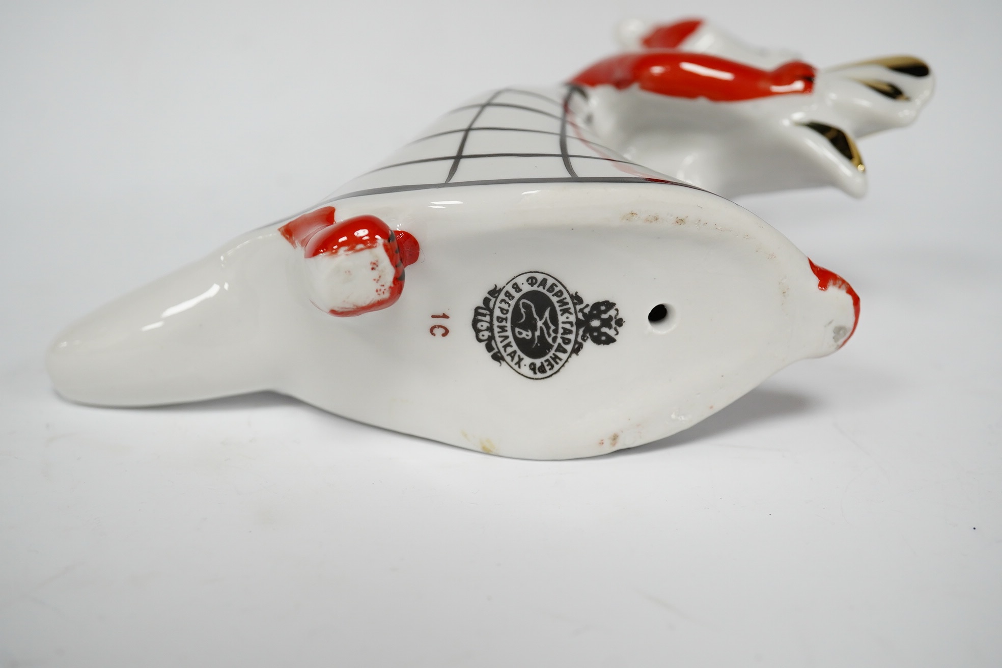 A Russian porcelain fox and rooster figure, stamped to the base, 18cm wide. Condition - good
